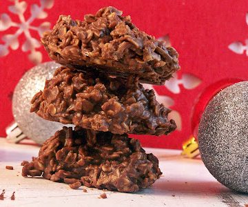 No Bake Nutella Cookies stacked on counter with Christmas ornaments scattered around