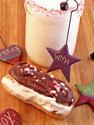 Peppermint Eclairs on a wood surface with glass of milk in background