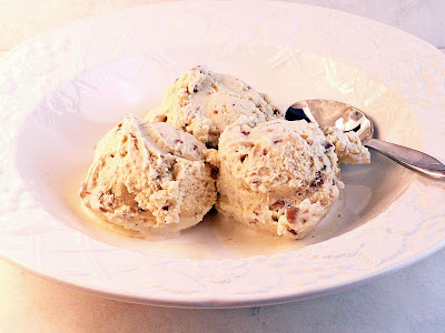 Butter Pecan Ice Cream served in a white bowl