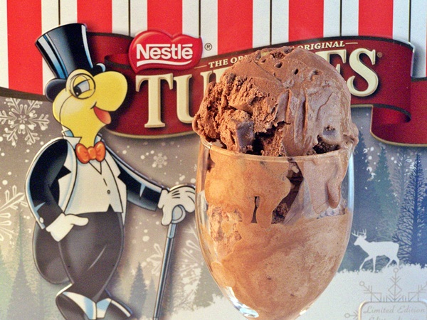 Turtles Ice Cream served in wine glass with box of chocolates in the background