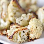 close up image of Roasted Cauliflower from cravingsofalunatic.com. Roasted Cauliflower is one of the easiest side dish recipes to make. The perk is it's also incredibly tasty. Roasting brings out the natural sweetness of the cauliflower. 