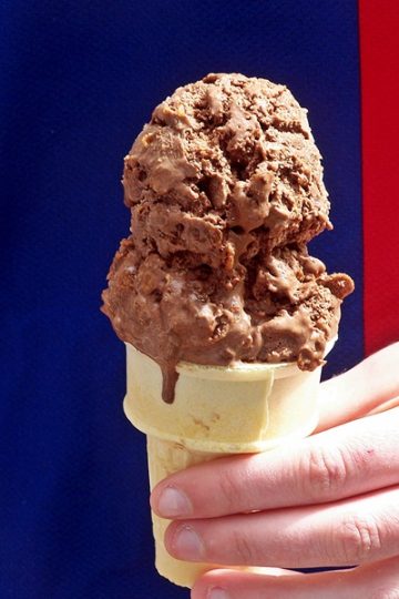 Cocoa pebbles ice cream served in a cone.