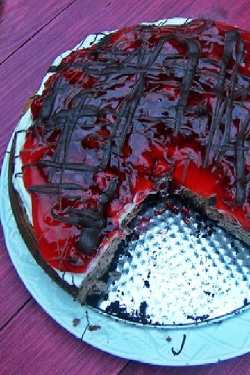 Overhead image of black forest cheesecake with a slice removed