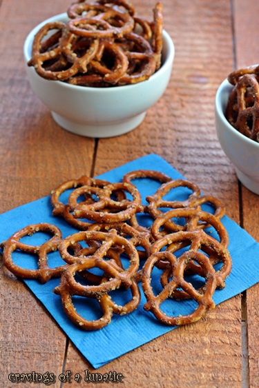 Taco Pretzels in white bowls and spread on a blue napkin for snacking