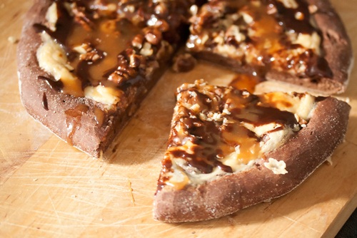 Turtle Cheesecake Pizza {Guest Post from Crumb A Food Blog} on cravingsofalunatic.com - A wonderful dessert pizza with layers of cheesecake filling, chocolate, and caramel from Isabelle Boucher of Crumb! 