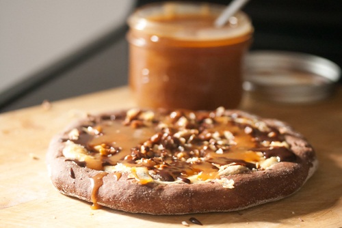 Turtle Cheesecake Pizza {Guest Post from Crumb A Food Blog} on cravingsofalunatic.com - A wonderful dessert pizza with layers of cheesecake filling, chocolate, and caramel from Isabelle Boucher of Crumb! 