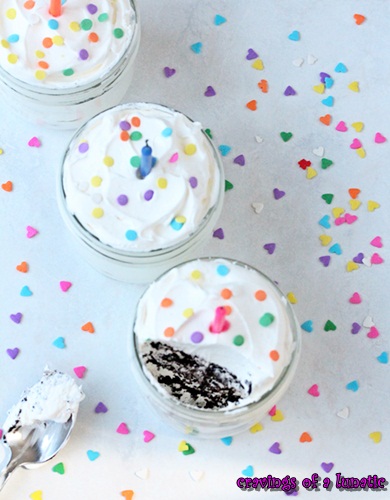 No bake cake served in jars with lots of sprinkles all over