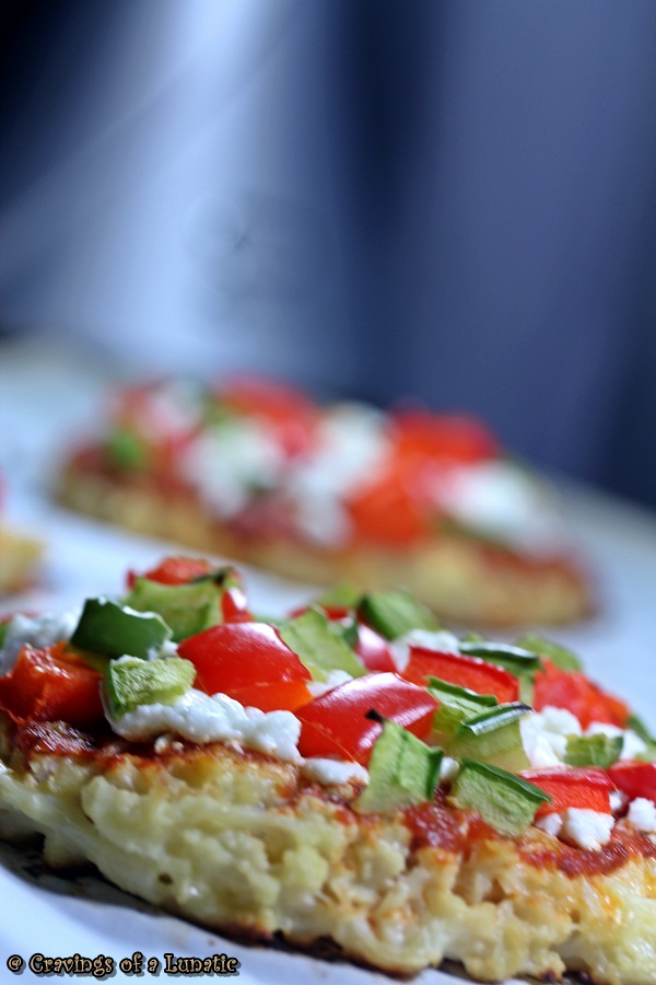 Cauliflower Pizza with Peppers. A healthy and delicious cauliflower base pizza topped with goat cheese and peppers.