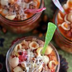 Pasta e Fagioli served in wide mouth mason jars with colourful spoons