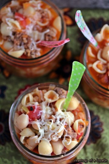 Pasta e Fagioli served in wide mouth mason jars with colourful spoons