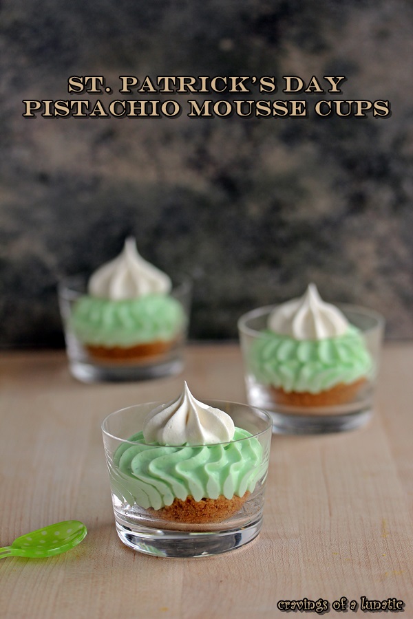 St Patricks Day Pistachio Mousse Cups are desserts layered with crushed graham crackers, pistachio mousse and whipped cream in tiny glass cups for a cute presentation!