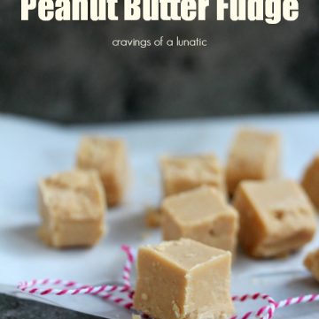 Microwave Peanut Butter Fudge cut into slices and on a counter with a napkin nearby.