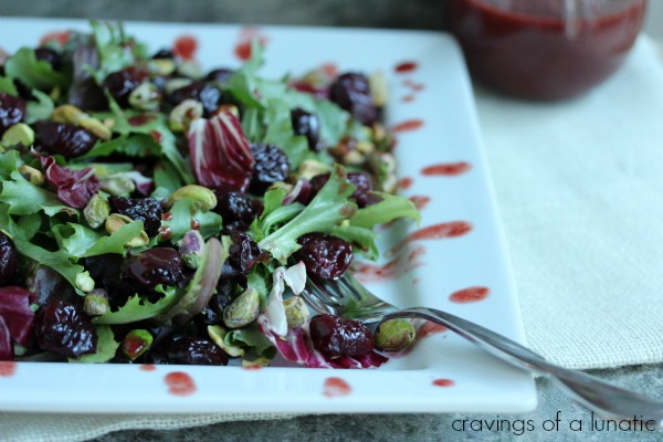 Roasted Cherry and Pistachio Salad with Roasted Cherry Vinaigrette on a white plate