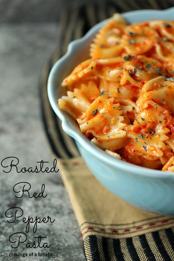 Roasted Red Pepper Pasta in a blue bowl on a cloth napkin.