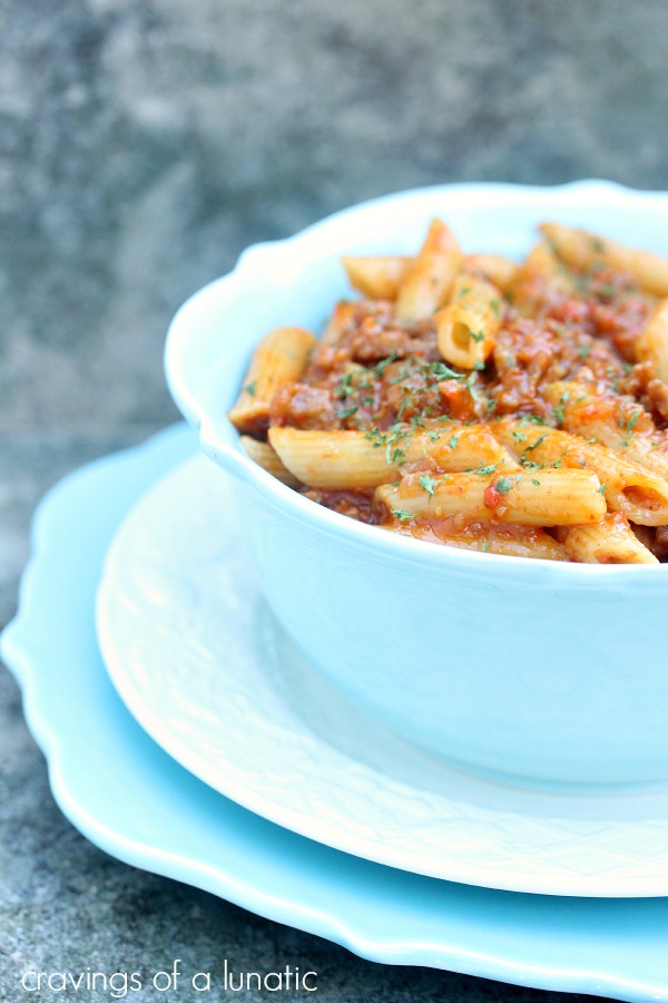 Roasted Red Pepper and Italian Sausage Pasta served in a blue bowl