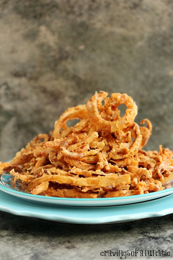 Onion Strings cooked to perfection and served on a colourful serving platter.