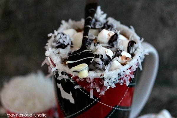Coconut Hot Chocolate with Chocolate Covered Spoons in s mug.