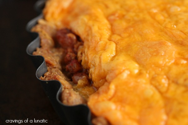Frito Pie from cravingsofalunatic.com- Frito Pie made with a frito crust, incredible chili filling and topped with mounds of glorious cheddar cheese. (@CravingsLunatic)