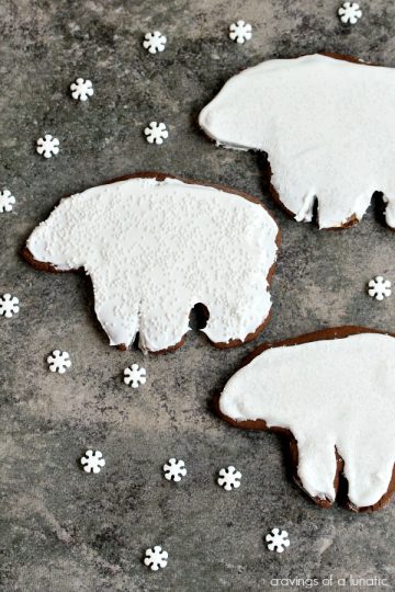 Gingerbread Polar Bear Cookies on a dark surface.