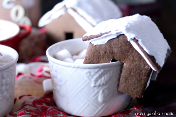 Mini Gingerbread House Hot Chocolate Mug Perches on white mugs