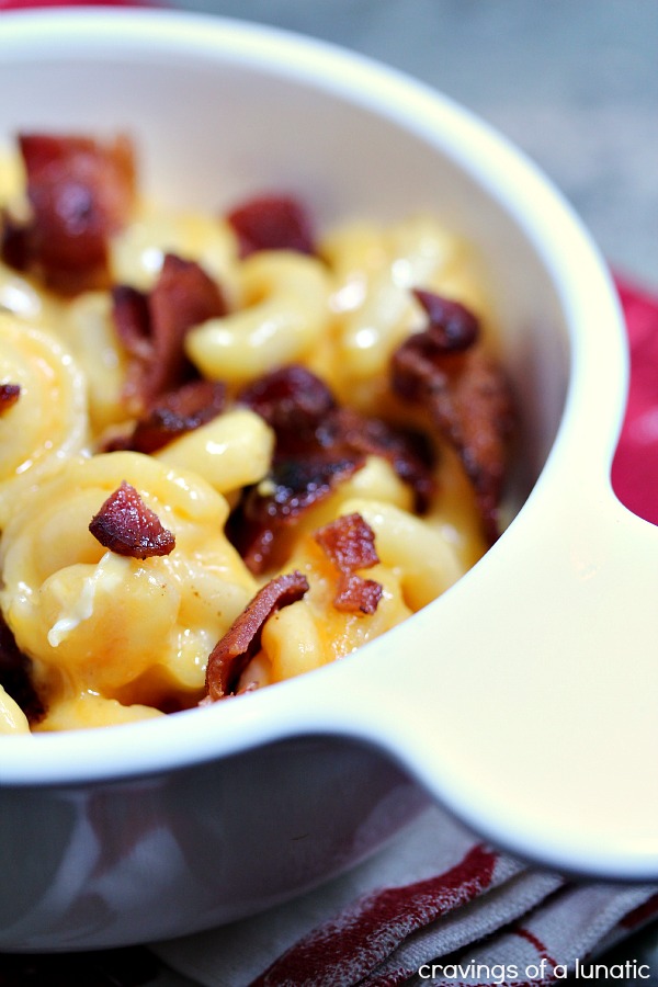 Smoked Bacon Mac and Cheese in a white casserole dish on a red and white napkin.