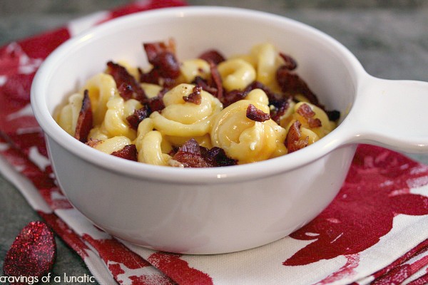 Smoked Bacon Mac and Cheese in a white bowl on a red and white napkin