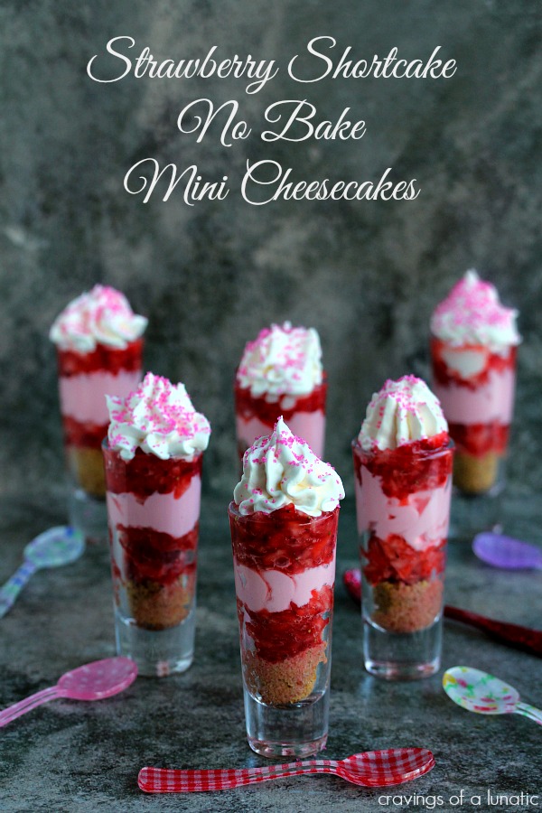 Strawberry Shortcake No Bake Mini Cheesecakes served layered in shot glasses with colored spoons