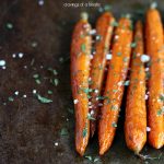 Balsamic Roasted Baby Carrots on a cookie sheet.