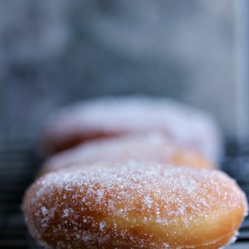 These Homemade Polish Paczki are the perfect dessert to celebrate Fat Tuesday or Mardi Gras. You can use lemon, apple, raspberry, strawberry, custard or any filling you love then dunk them in powdered sugar or glaze.  
