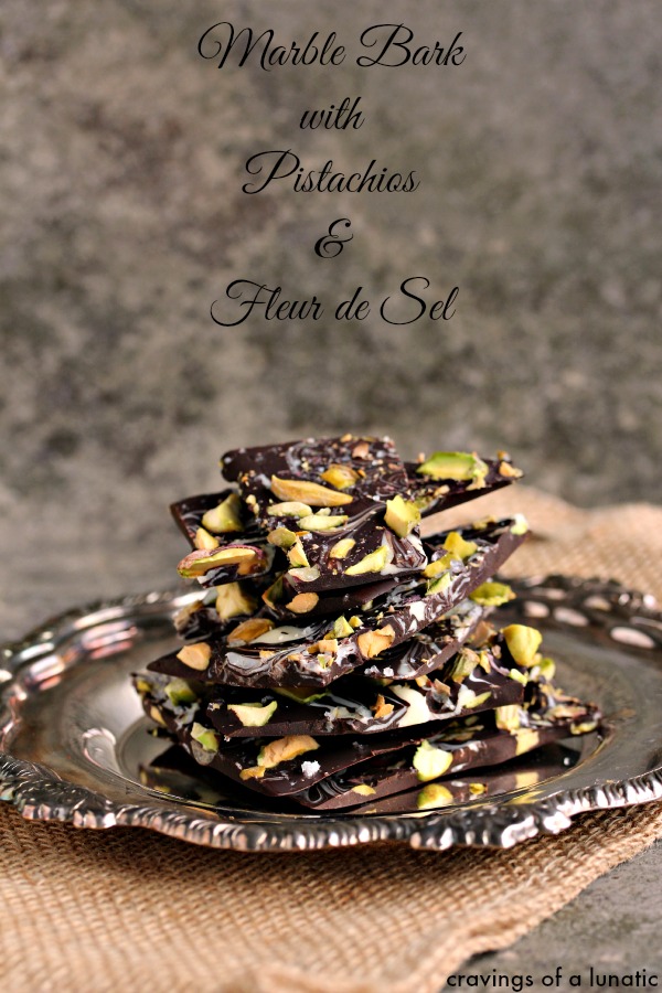 Marble Bark with Pistachios and Fleur de Sel stacked on a silver tray.
