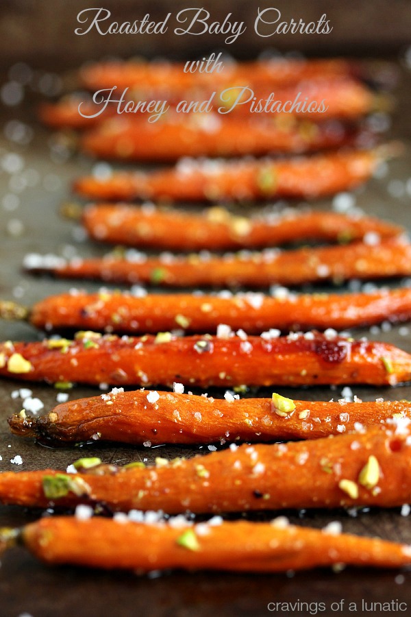 Roasted Carrots with Honey and Pistachios on a cookie sheet
