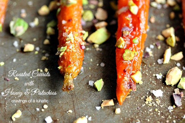 Roasted Carrots with Honey and Pistachios on a cookie sheet