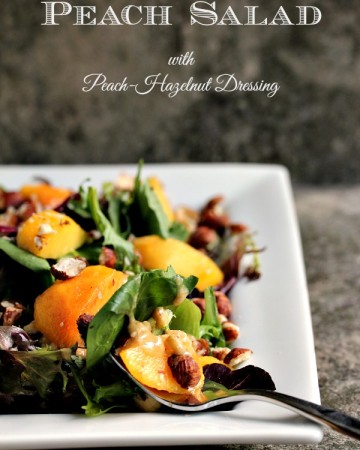 Peach Salad with Peach served on a white plate. Salad is drizzled with a Peach Hazelnut Dressing
