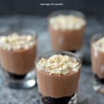 Chocolate and Cashew No Bake Cheesecakes served in shot glasses