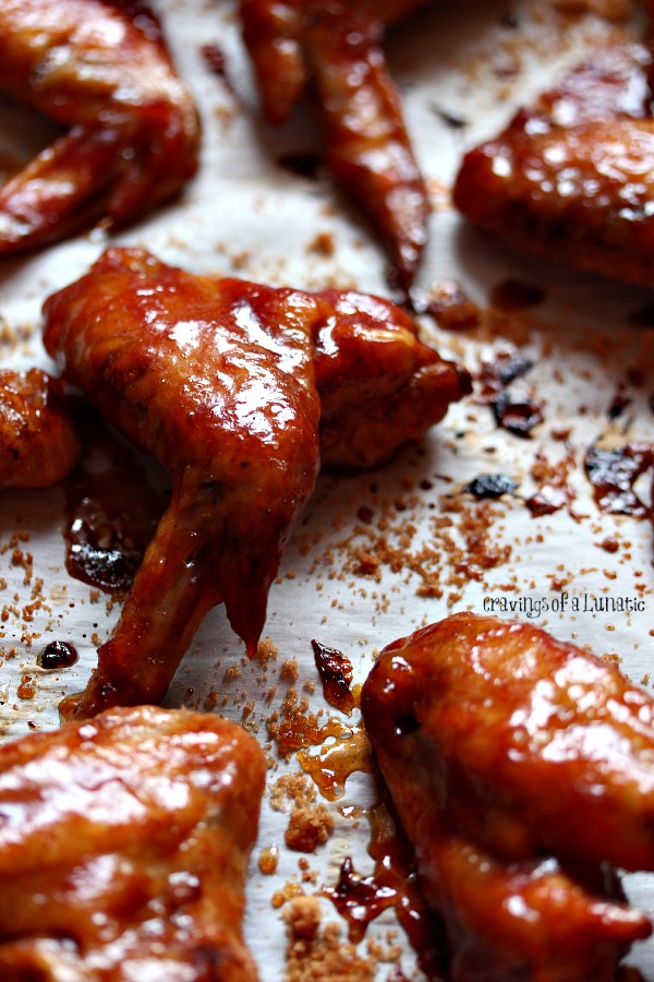 Slow Cooker Chicken Wings on a parchment lined pan