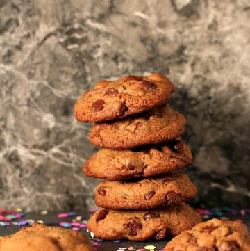 Chocolate Fudge Brownie Cookies stacked with random cookies around them.