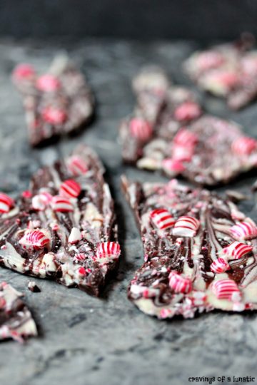 Chocolate Peppermint Bark broken into pieces and resting on a grey marble surface.