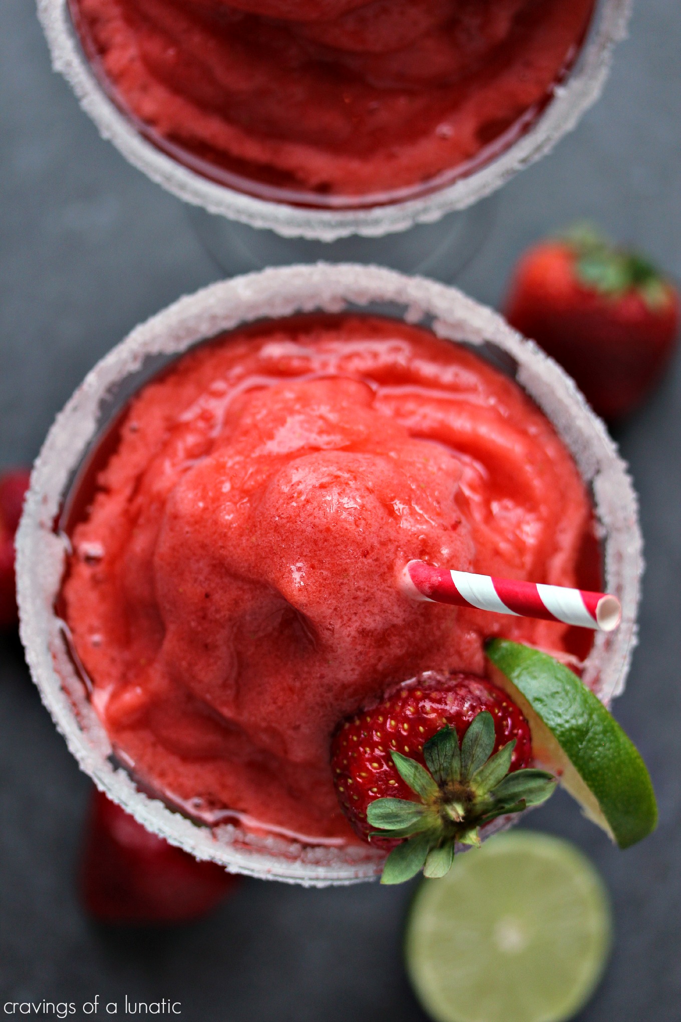 Frozen Strawberry Margaritas from cravingsofalunatic.com- Two recipes for fabulous Frozen Strawberry Margaritas, one is boozy, the other one is a virgin option. Whip one up today!