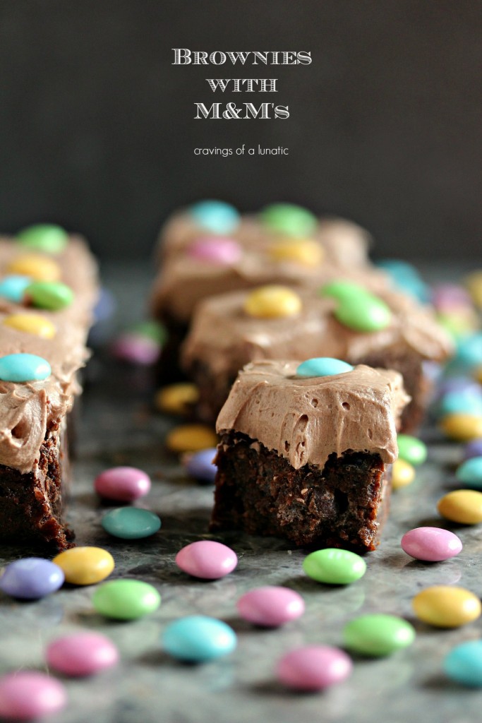 chocolate brownies with chocolate frosting and topped with M&M candies
