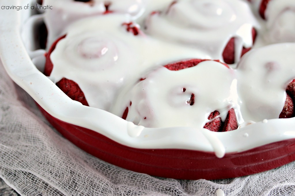 Red Velvet Sweet Rolls are baked in the oven then slathered with yummy icing. 