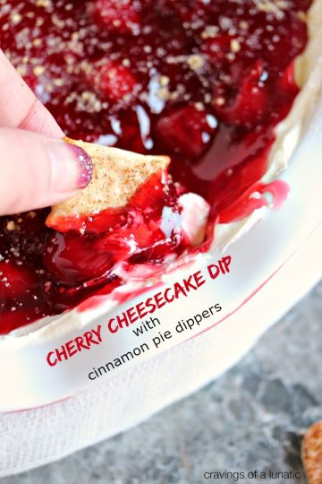 close up image Cherry Cheesecake Dip being scooped up with Cinnamon Pie Dippers