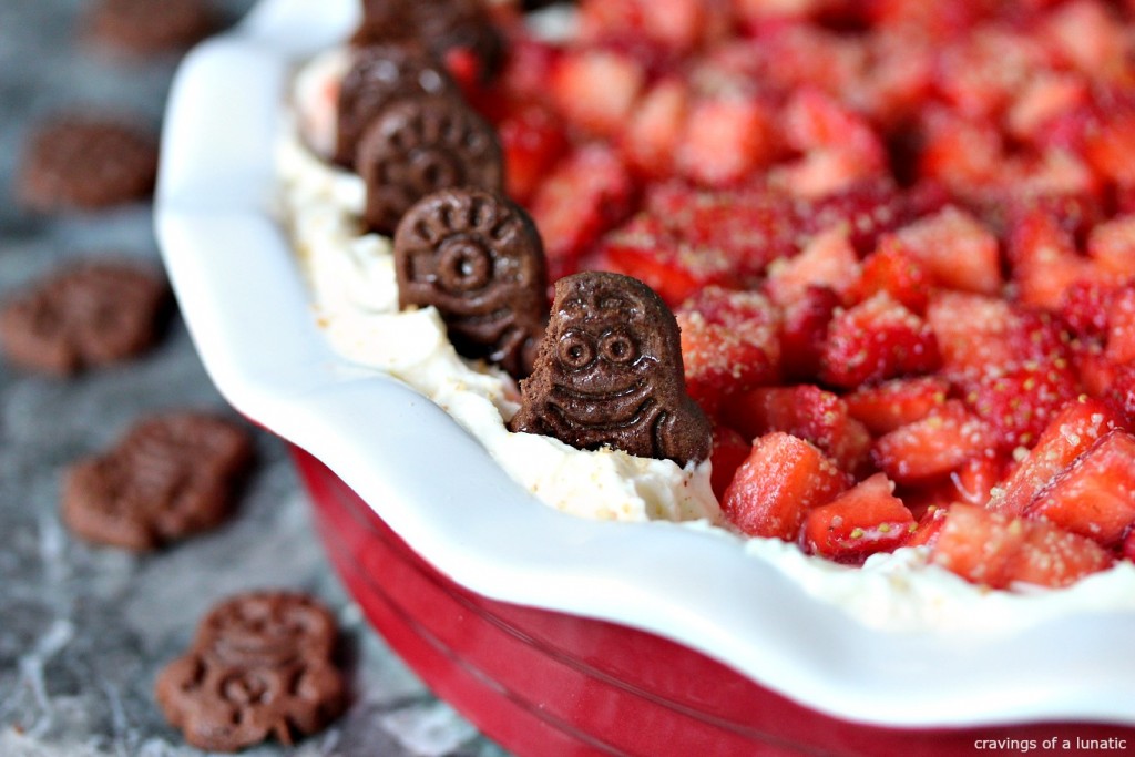 Strawberry Cheesecake Dip served in a red and white pie dish.