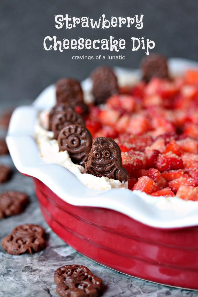 Strawberry Cheesecake Dip served in a red and white pie dish.