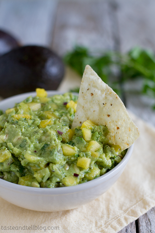 Tropical Guacamole from Taste and Tell, featured on cravingsofalunatic.com for Tailgating Time Week 7