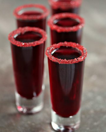 Walker Blood Sangria served in shot glasses with sugar around the rims.