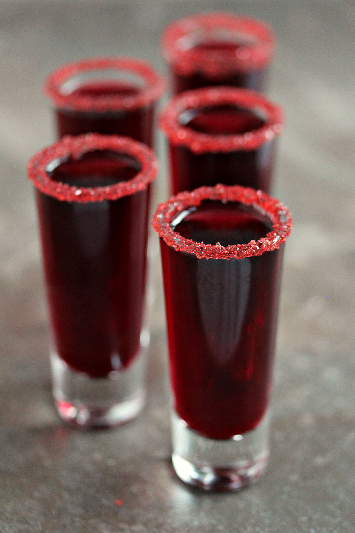 Walker Blood Sangria served in shot glasses with sugar around the rims.
