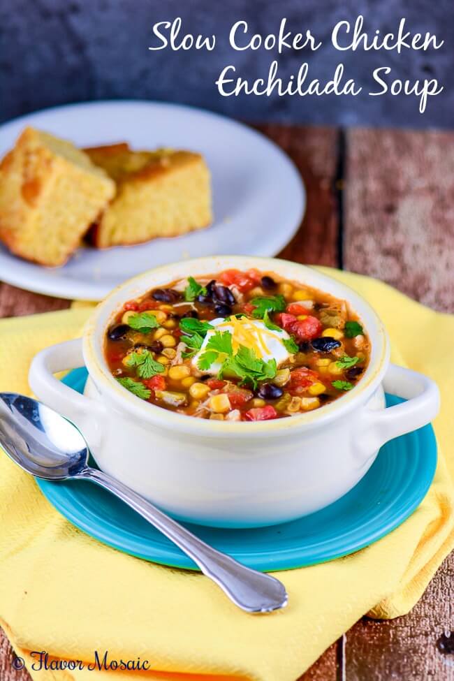 Slow Cooker Chicken Enchilada Soup from Flavor Mosaic served in a white bowl