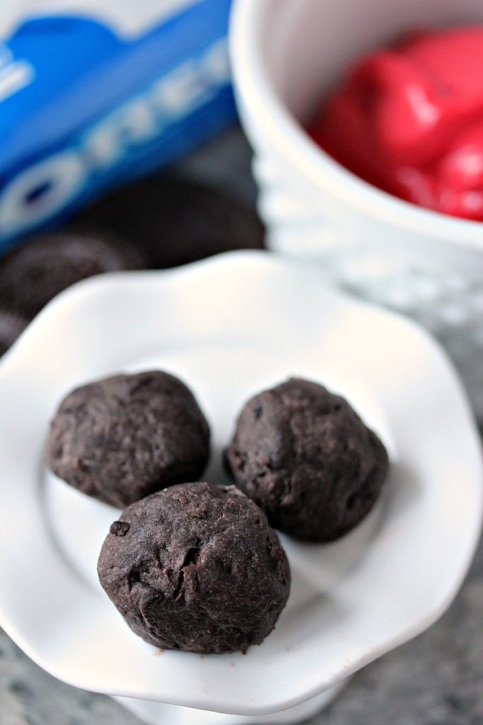 Oreo balls ready to be dunked into chocolate.