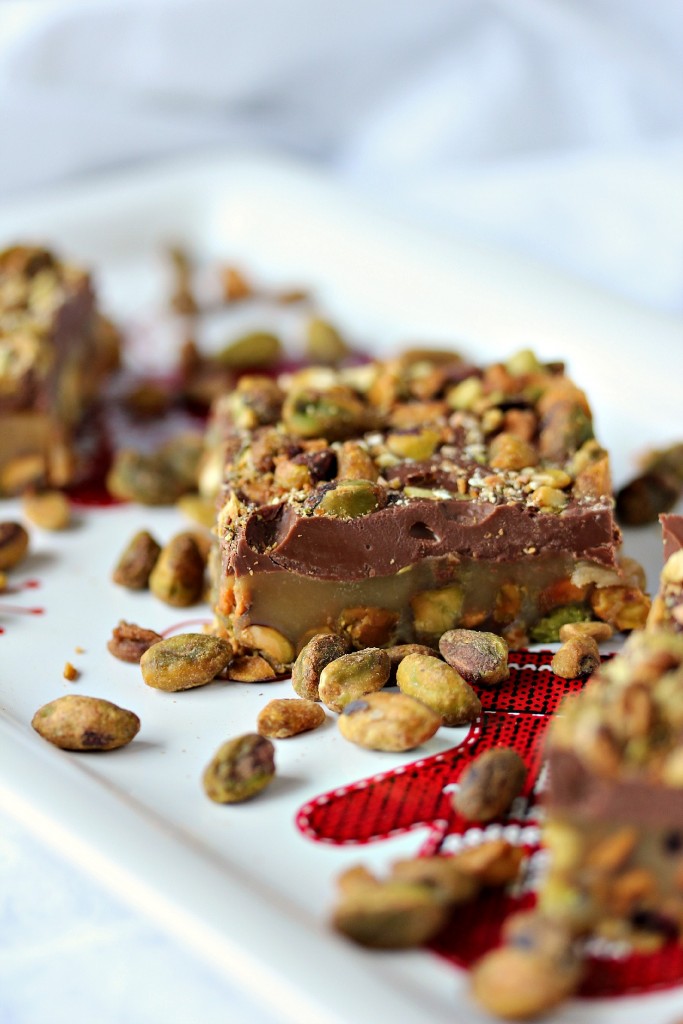 Pistachio Roca from cravingsofalunatic.com- For all my fellow Pistachio Lovers out there, this one is for YOU! It's Pistachio Roca, layers of pistachios, caramel, chocolate, and more pistachios. It's little bites of candy heaven!
