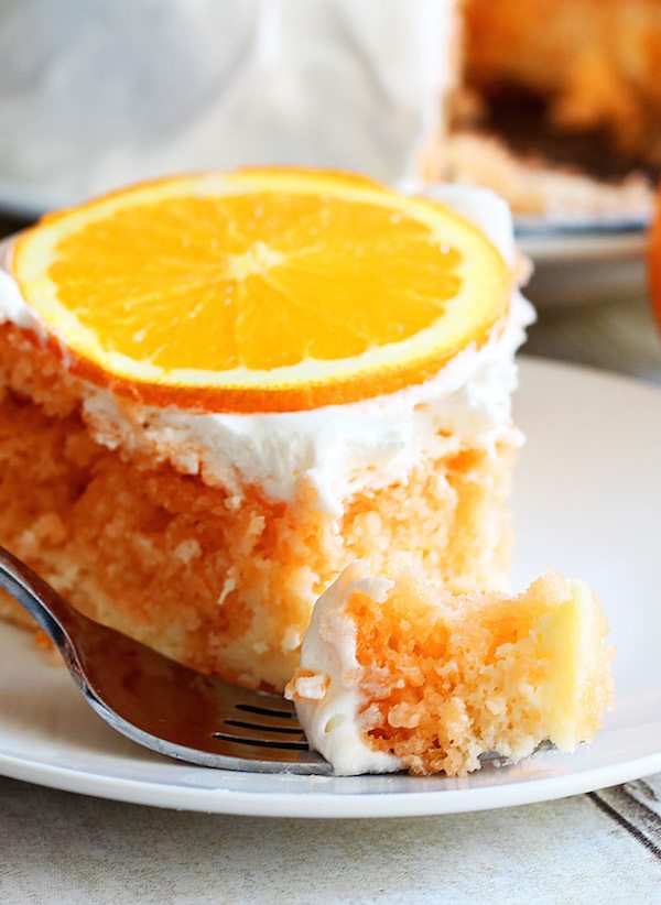 orange cake served on a white plate